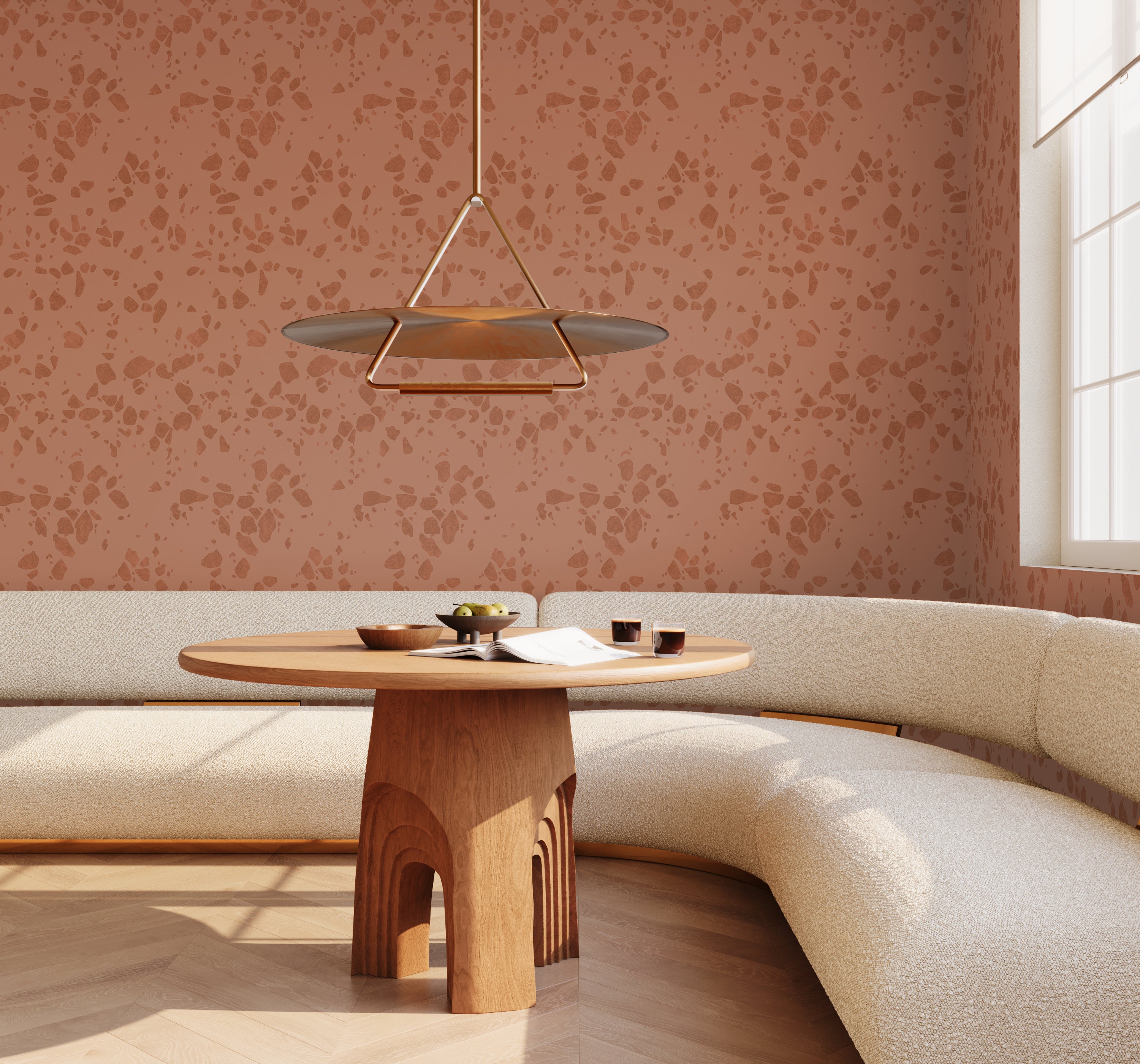 Modern interior with a curved beige sofa, wooden table, and floral-patterned wall from drop it MODERN.