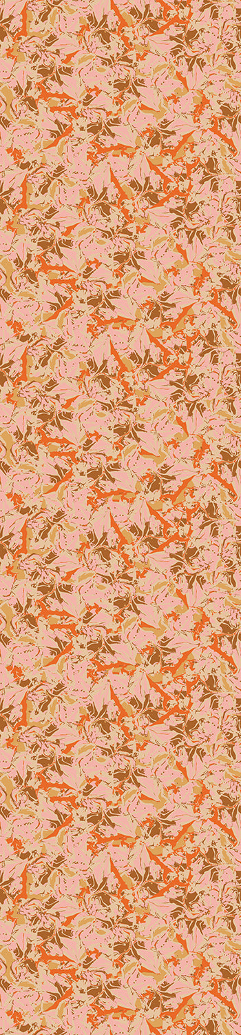 A rolled wallpaper showing a floral pattern with shades of orange, brown, and pink from drop it MODERN.