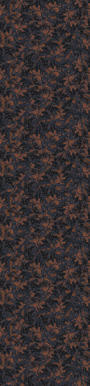 A roll of untrimmed Iris wallpaper in shades of black and brown with a floral pattern from drop it MODERN.