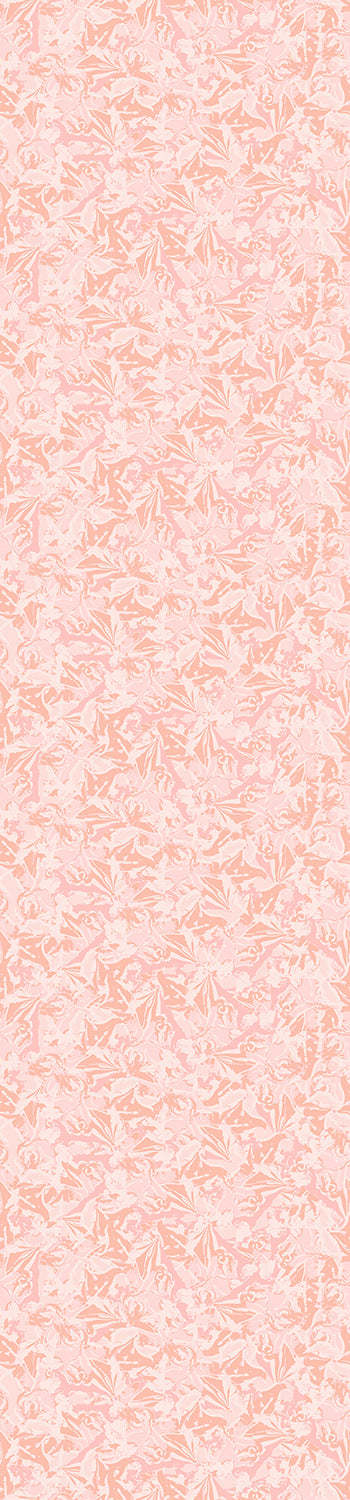 A rolled piece of wallpaper displaying a floral pattern in pink and white colors from drop it MODERN.