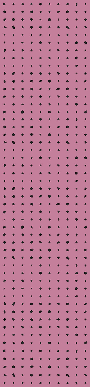 A roll of dotted line wallpaper in purple color with black dots pattern from drop it MODERN.