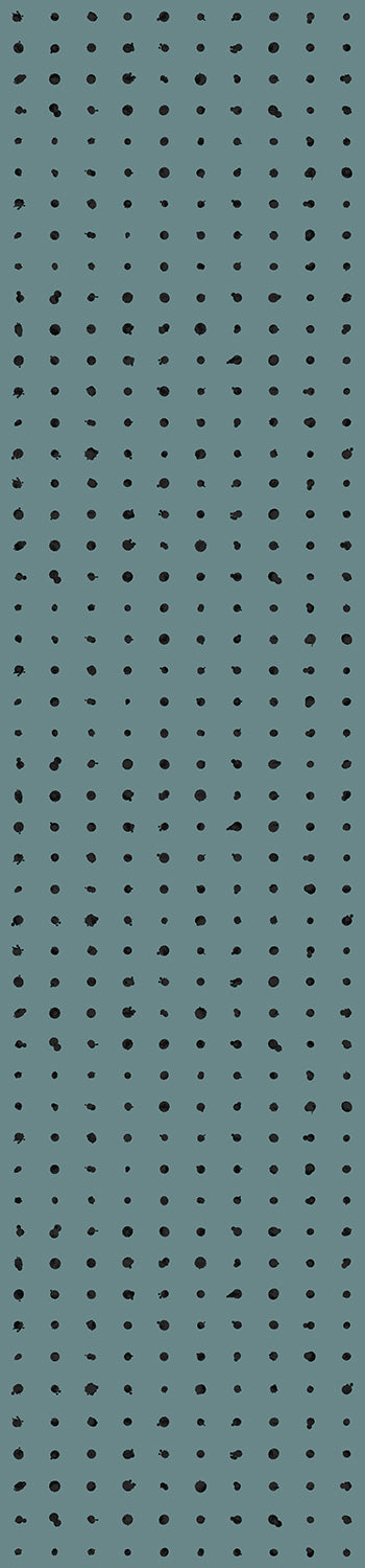 A roll of dotted line wallpaper in teal color, with a visible pattern of black dots on the surface from drop it MODERN.