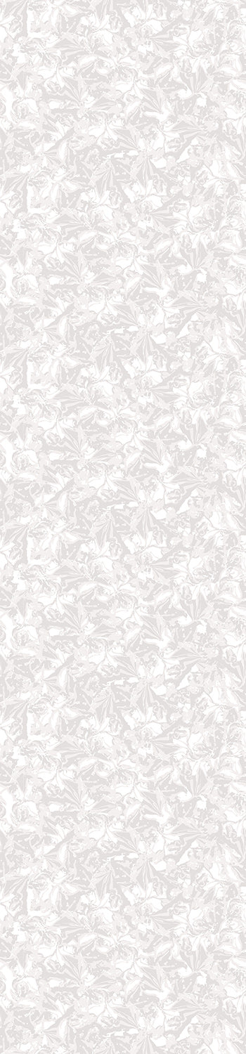 A rolled-up piece of Iris wallpaper in grey with a floral pattern, against a white background from drop it MODERN.