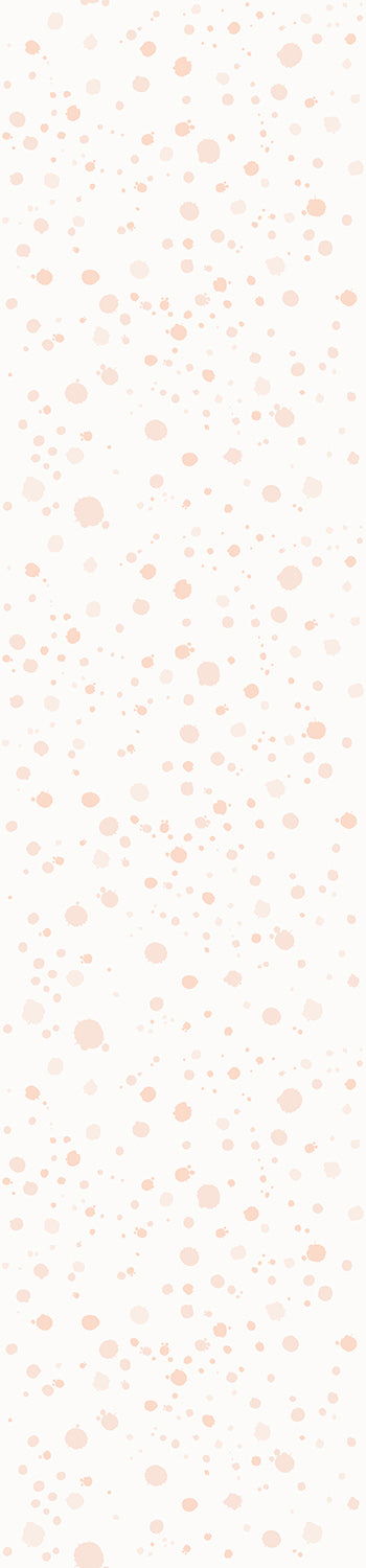 A rolled-up wallpaper showing a light pink ink drop pattern on a white background from drop it MODERN.