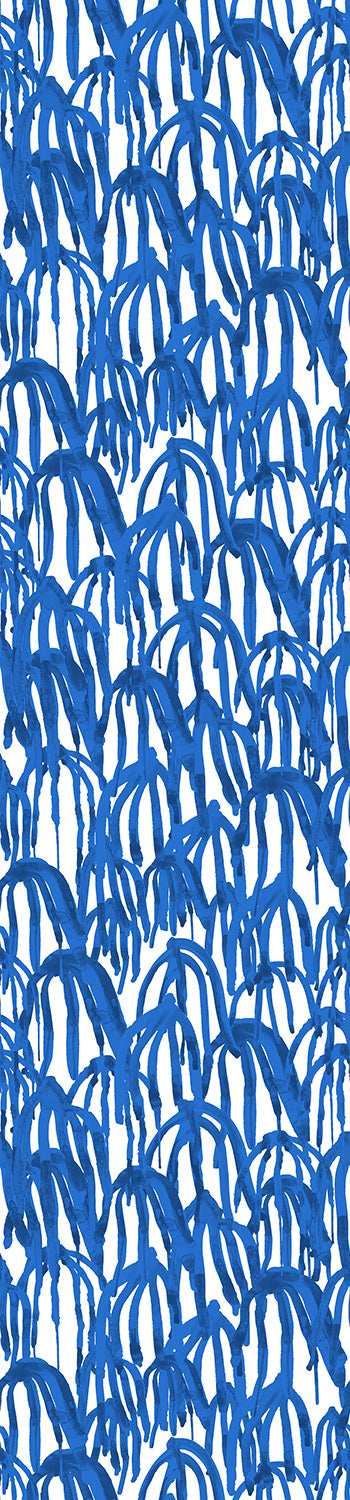 A roll of blue wallpaper featuring a geometric pattern with a modern design from drop it MODERN.