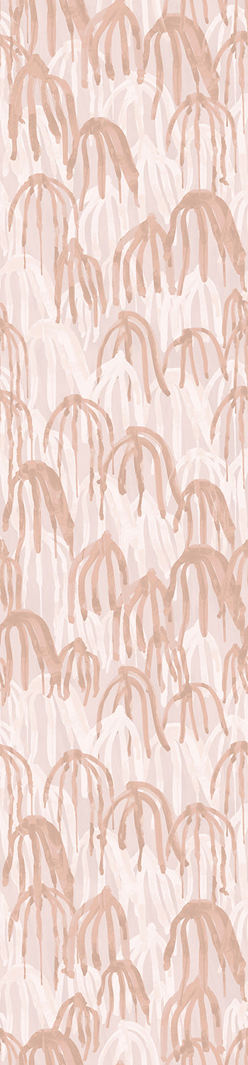 A roll of wallpaper featuring a pink kelp pattern on a white background from drop it MODERN.