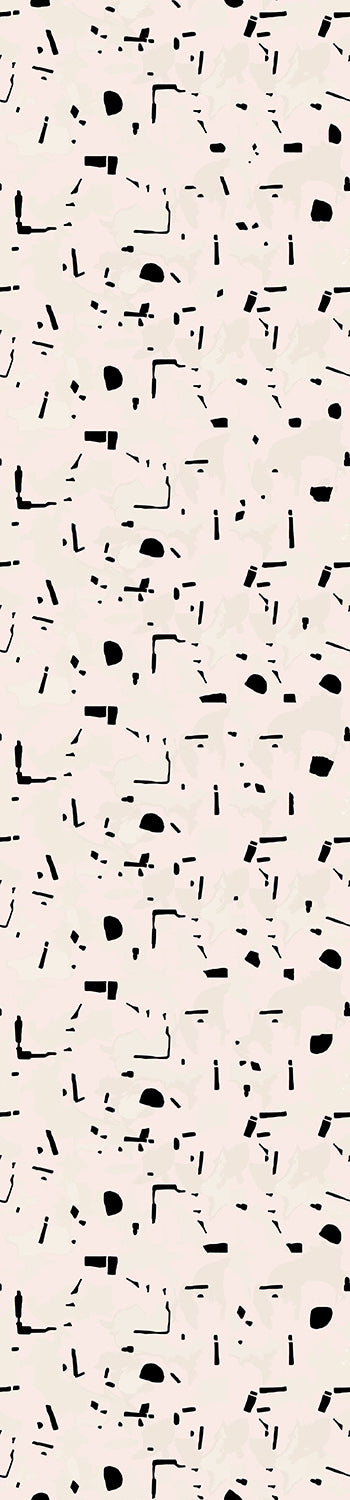 A roll of wallpaper with a geometric pattern consisting of black shapes on a beige background from drop it MODERN.